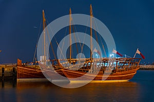 Traditional dhows mooring in Doha in Qatar during night