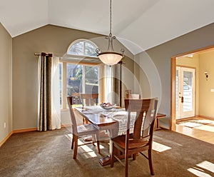 Traditional dinning room with carpet, in beautiful northwest home.