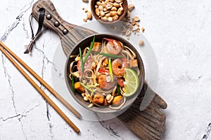 Traditional dish of asian cuisine is pad thai. Udon noodles with shrimps and fried tofu