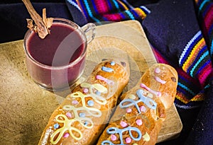 Traditional dish and drink Ecuador, called: Colada Morada and bread guaguas