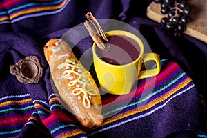 Traditional dish and drink Ecuador, called: Colada Morada and bread guaguas