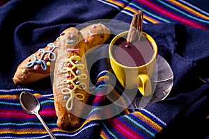 Traditional dish and drink Ecuador, called: Colada Morada and bread guaguas