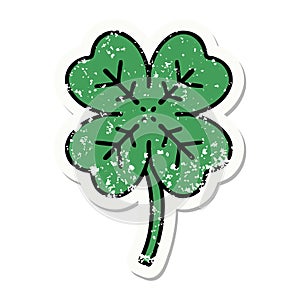 traditional distressed sticker tattoo of a 4 leaf clover