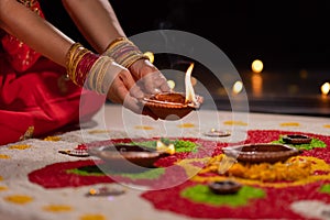 Traditional diya lamps lit during diwali celebration
