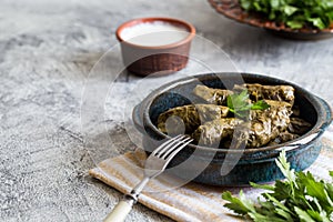 Traditional dolma  sarma in grape leaves with copyspace. Lebanon turkish greek middle eastern cuisine. Dinner food dolmadakia photo