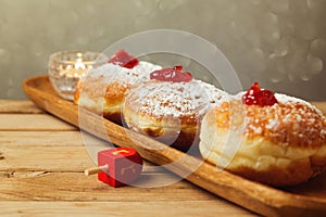 Traditional doughnuts for Jewish Holiday Hanukkah. Selective focus on the doughnut in the middle