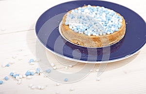 Traditional Dutch birth celebration biscuit with blue muisjes