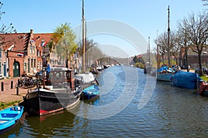 Traditional Dutch Botter Fishing Boats in the small Harbor of the Historic Fishing Village in Netherlands.