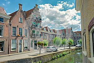 Traditional dutch canal houses along a canal