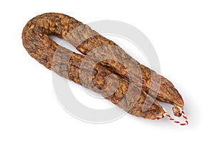 Traditional Dutch dried mature sausage, boerenmetworst close up on white background