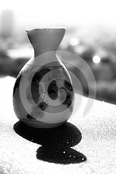 Flowery vase with bright green background photo