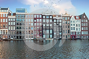 Traditional dutch houses along the canals in Amsterdam Netherlands