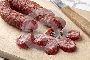 Traditional Dutch Metworst, preserved pork sausageand slices close up