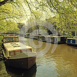 traditional dutch old buildings and houseboats in the canal, Amsterdam, the Netherlands