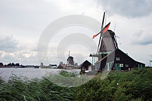 Traditional Dutch old wooden windmill in Zaanse Schans - museum