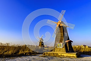 Traditional Dutch old wooden windmill in Zaanse Schans - museum village in Zaandam