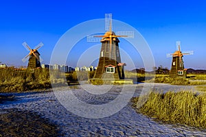 Traditional Dutch old wooden windmill in Zaanse Schans - museum village in Zaandam