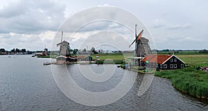 Traditional Dutch old wooden windmill in Zaanse Schans - museum