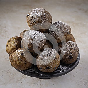 Traditional Dutch oliebollen on light background, served on New Years Eve