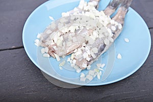 Traditional Dutch raw herring with onions