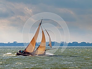 Traditional Dutch sailing ship a `Botter` at the Markermeer