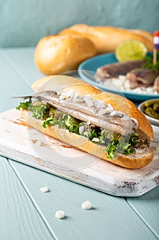 Traditional dutch snack, seafood sandwich with herring