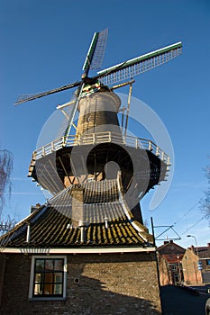 Traditional dutch windmill in the city of Delft photo