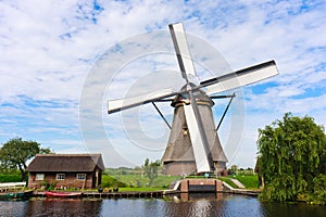 Traditional Dutch windmill with its house