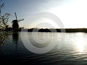Traditional dutch windmill near the canal