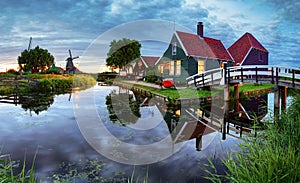 Traditional dutch windmill near the canal. Netherlands, Landcape at night