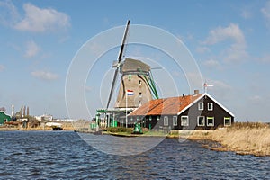 Traditional Dutch windmill near the river, the Netherlands