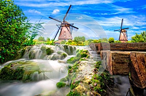 Traditional dutch windmills and river.
