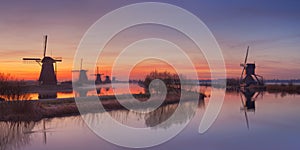 Traditional Dutch windmills at sunrise at the Kinderdijk