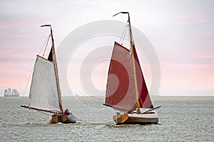 Traditional dutch wooden boats at the IJsselmeer in Friesland the Netherlands at sunset