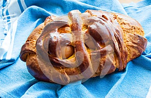 Folar de Ovos. Typical Portuguese breads for Easter with two boiled eggs photo