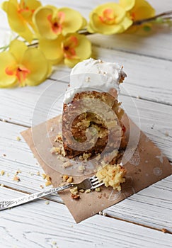 A traditional Easter cake and festive decoration on a white wooden surface