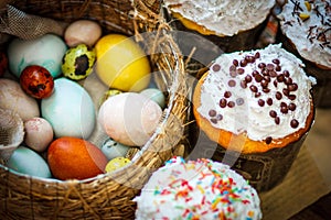 Traditional easter cake kulich Ukrainian with colored eggs in th