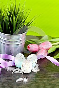 Traditional easter egg decoration with tulips and ribbo