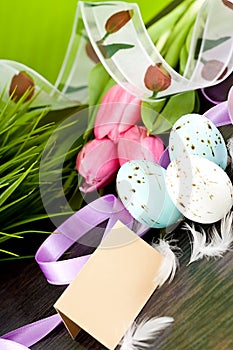 Traditional easter egg decoration with tulips and ribbo