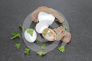 Traditional Easter eggs put in a sock with parsley leaves