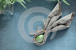 Traditional Easter rustic eggs decoration with bunny ears napkin, aesthetic spring background with copy space