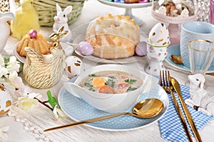 Traditional Easter white borscht on festive table