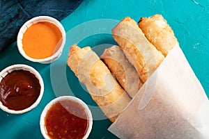 Traditional eastern cheese-filled rolls with a variety of dips