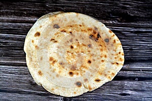 Traditional Egyptian flat bread with wheat bran and flour, regular Aish Baladi or Egypt bread baked in extremely hot ovens, it is