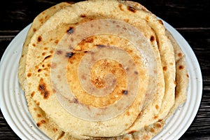 Traditional Egyptian flat bread with wheat bran and flour, regular Aish Baladi or Egypt bread baked in extremely hot ovens, it is