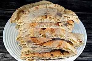 Traditional Egyptian flat bread with wheat bran and flour, regular Aish Baladi or Egypt bread baked in extremely hot ovens, it is