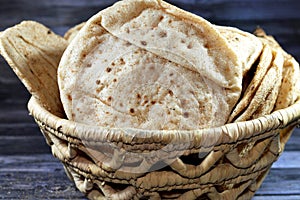 Traditional Egyptian flat bread with wheat bran and flour, regular Aish Baladi or Egypt bread baked in extremely hot ovens, it is