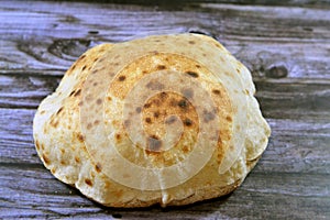 Traditional Egyptian flat bread with wheat bran and flour, regular Aish Baladi or Egypt bread baked in extremely hot ovens, it is