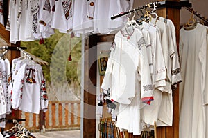 Traditional embroidered romanian blouses exposed for sale photo
