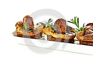 Traditional English fayre, Yorkshire pudding and grilled sauages with rosemary, nationally referred to as Toad In The Hole. Served photo